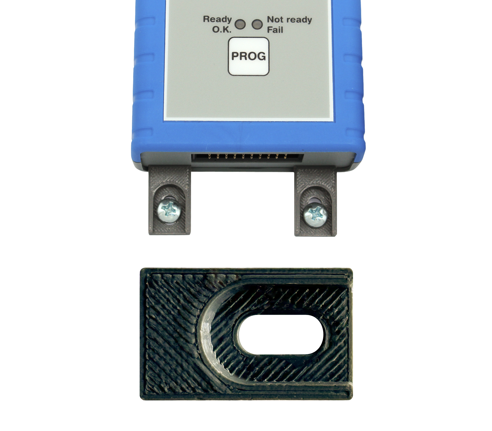 Mounting brackets Image depicts a small electronic device with a blue casing featuring indicator lights labeled "Ready," "Not Ready," and "Fail," along with a button labeled "PROG." Below, there is a black connector piece with an oval cutout, likely for attachment or interface purposes.