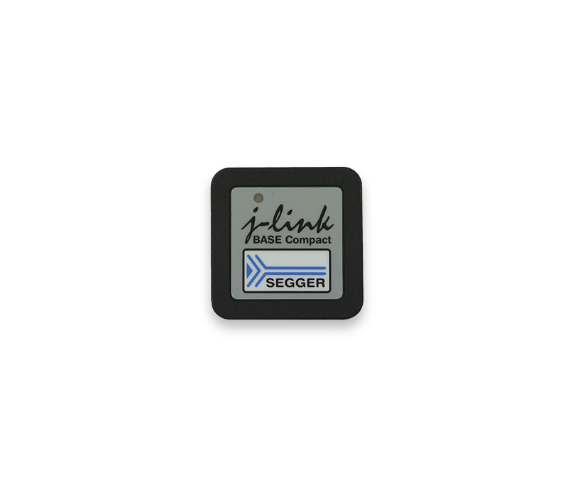 J-Link BASE Compact A small square device labeled "j-link BASE Compact" with the SEGGER logo, designed for programming and debugging embedded systems. The background is white, emphasizing the device's details and branding.